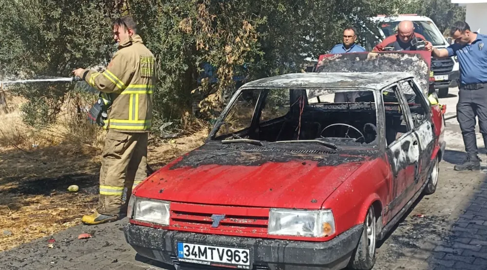Edremit’te araç yangını otluk alana sıçradı